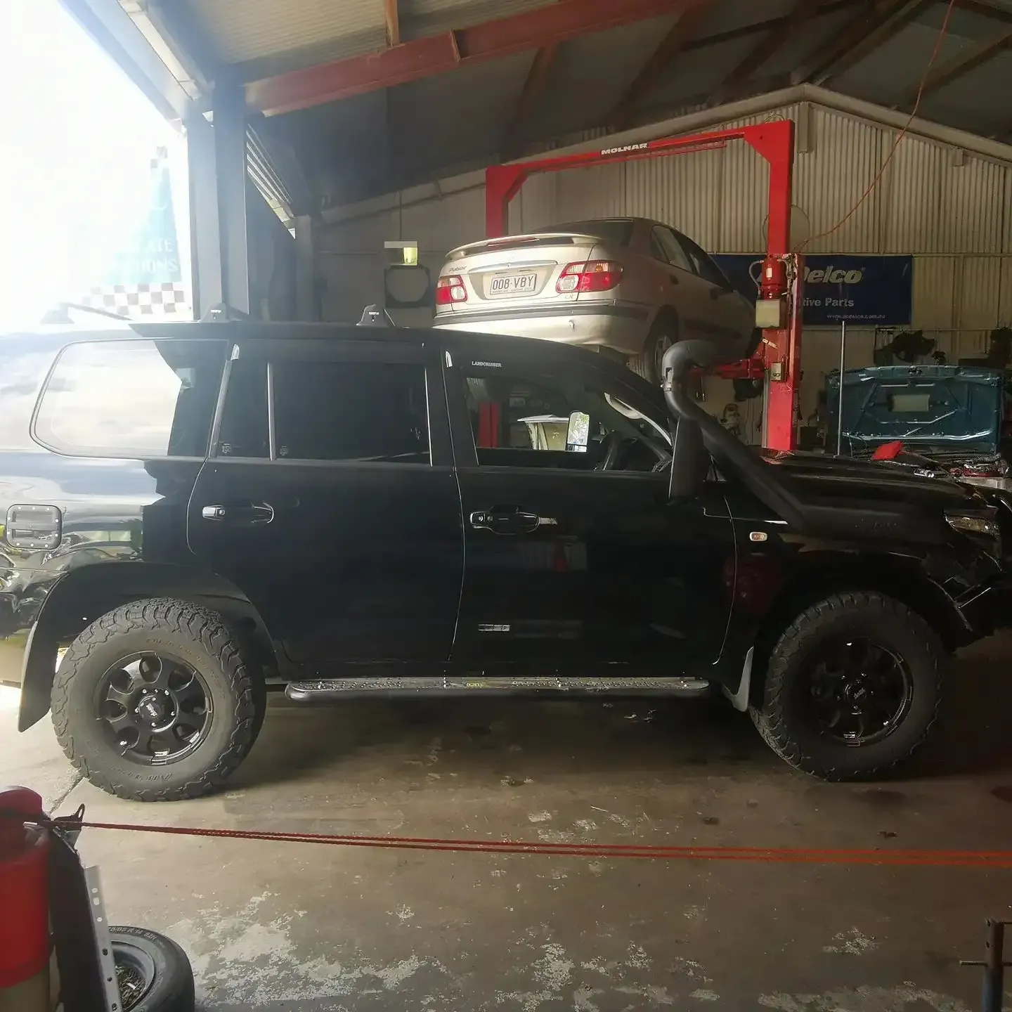 Lifted 4WD ute in the S & A Automotive workshop